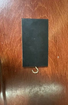 Block with hook and different surfaces for friction investigation